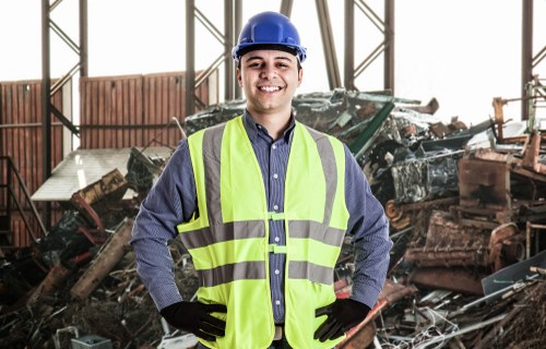 Workers managing construction debris
